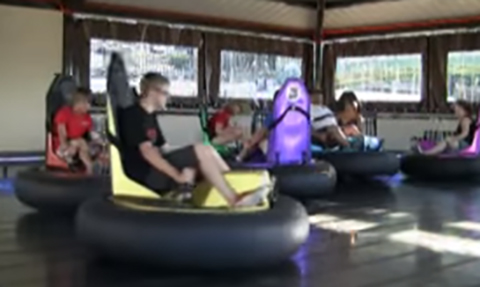 people riding bumper cars